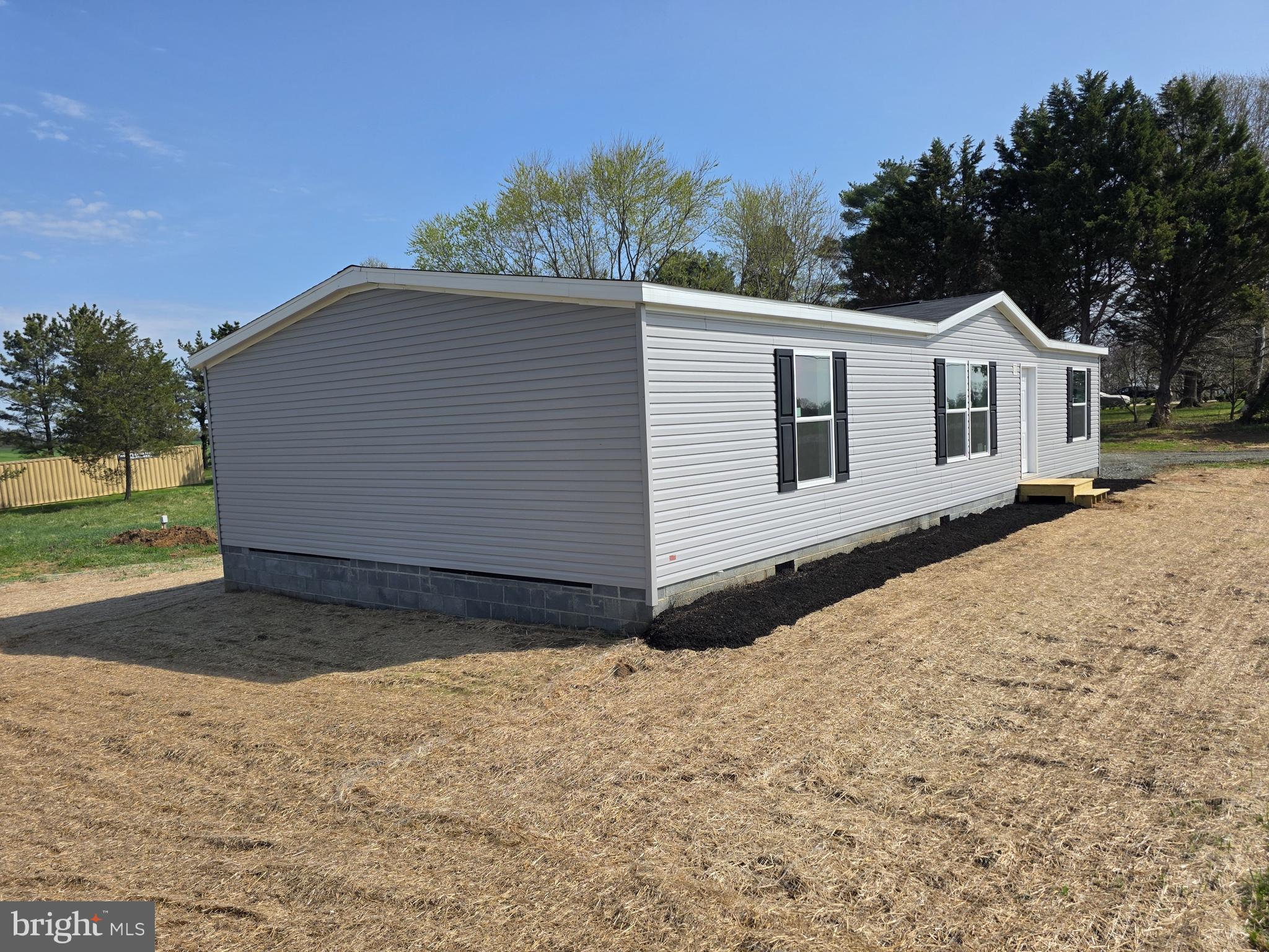 289 Grove Neck Road Earleville, MD 21919 - Photo 18 of 19 a view of a house with a yard