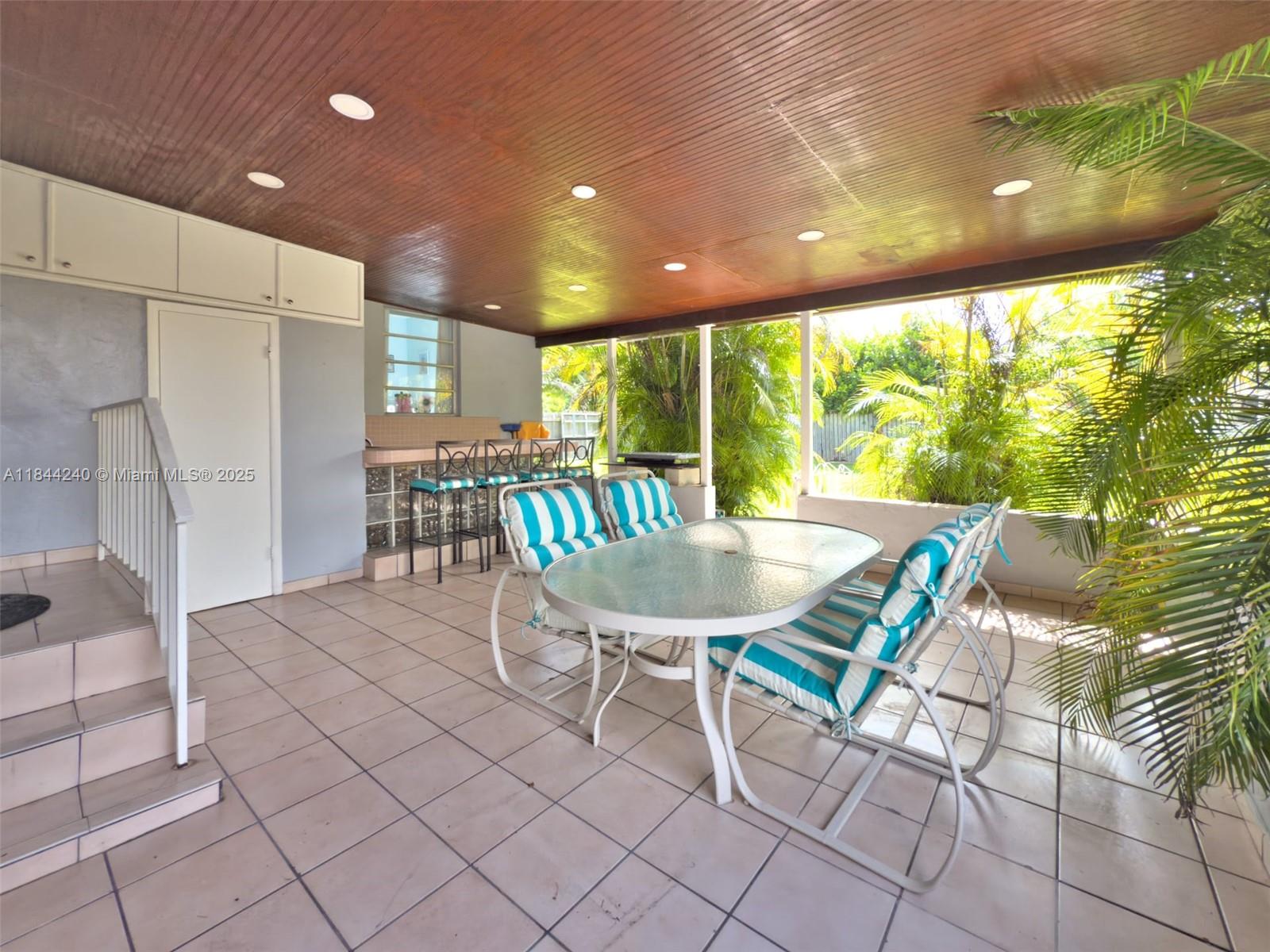 6290 Southwest 37th Street Miami, FL 33155 - Photo 11 of 34 a view of a dining room with furniture window and outside view