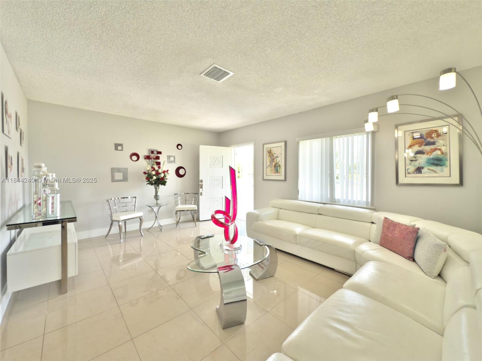 6290 Southwest 37th Street Miami, FL 33155 - Photo 15 of 34 a living room with furniture and a large window