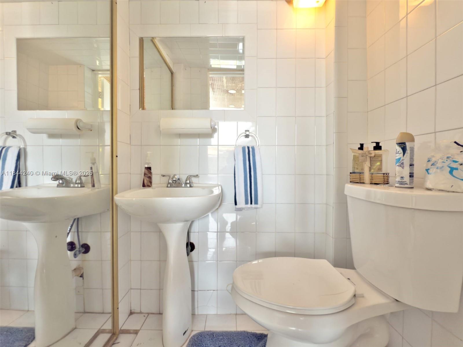 6290 Southwest 37th Street Miami, FL 33155 - Photo 31 of 34 a bathroom with a sink toilet and mirror