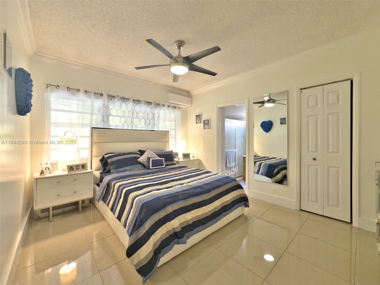 6290 Southwest 37th Street Miami, FL 33155 - Photo 32 of 34 a bed room with a bed and a chandelier