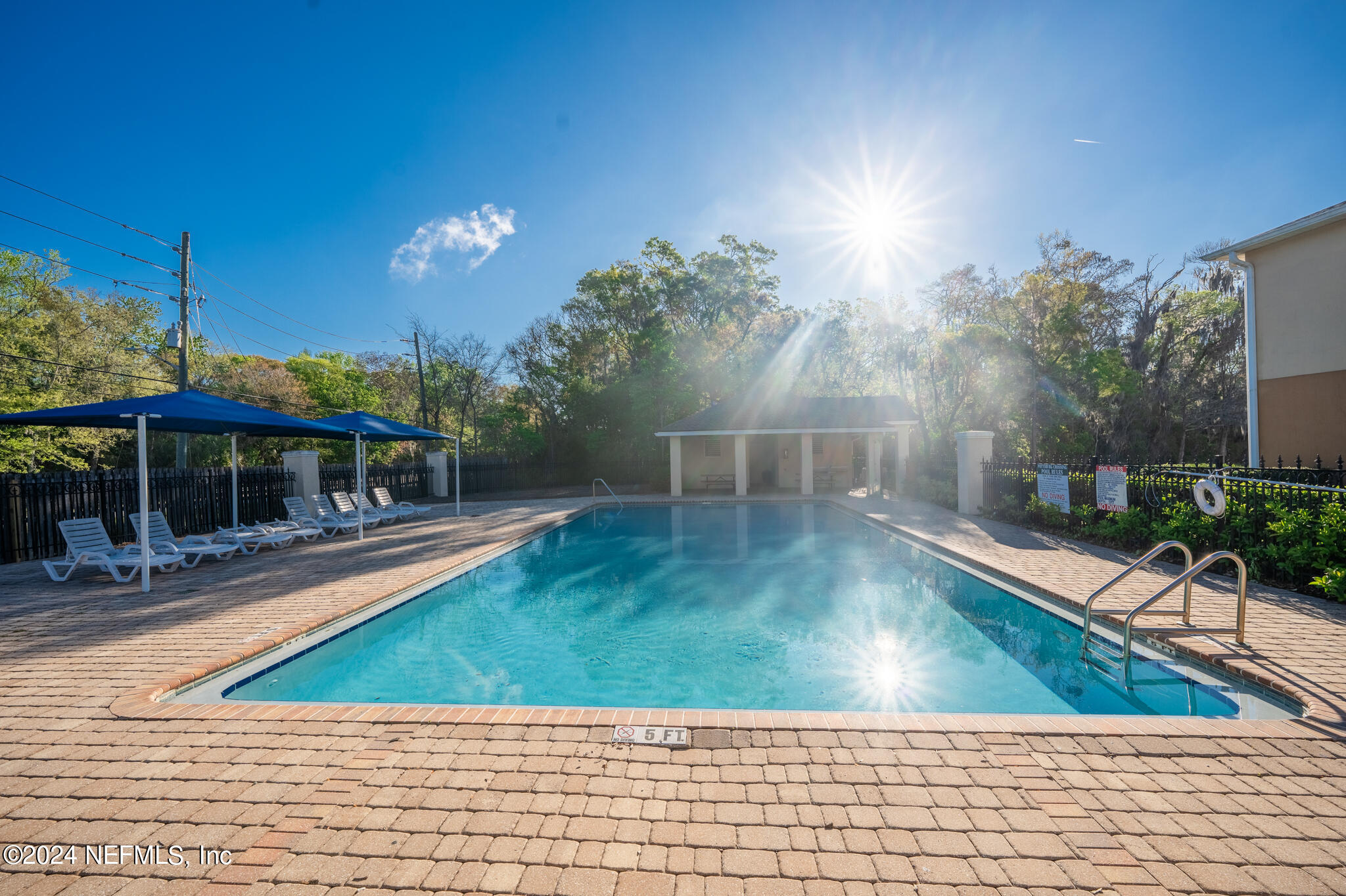 6700 Bowden Road, Unit 2003 Jacksonville, FL 32216 - Photo 29 of 30 a view of a swimming pool with a patio
