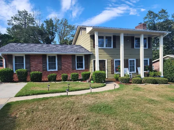 a front view of a house with a yard