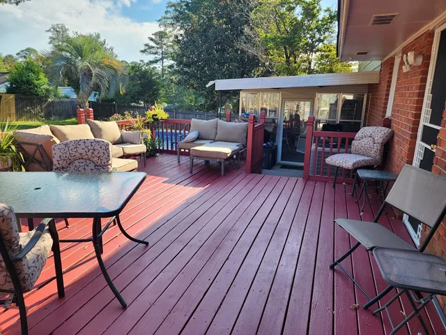 a outdoor space with patio the couches and a dining table with chairs