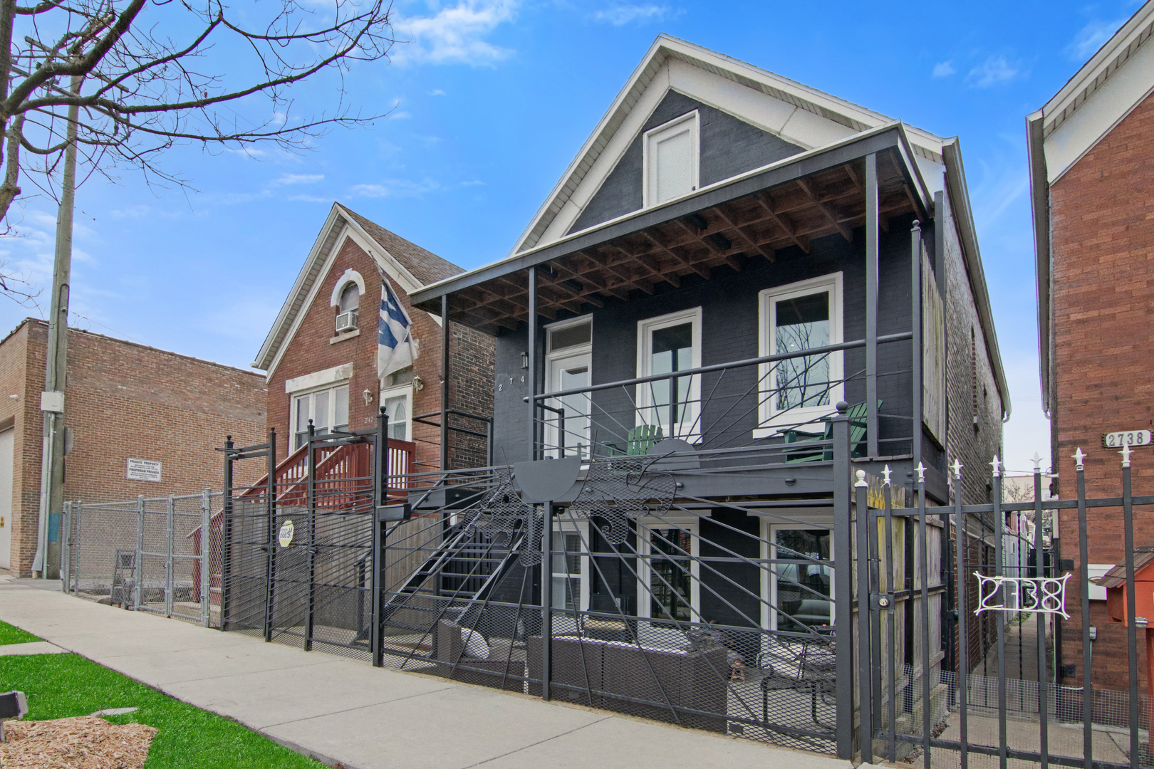 2740 South Troy Street, Unit 1F Chicago, IL 60623 - Photo 1 of 13 a front view of a house with garage