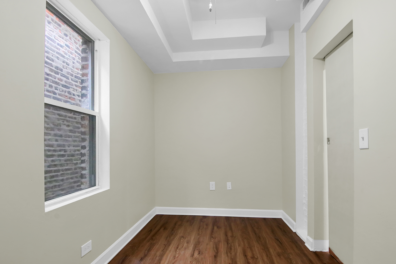 2740 South Troy Street, Unit 1F Chicago, IL 60623 - Photo 11 of 13 a view of wooden floor in a room