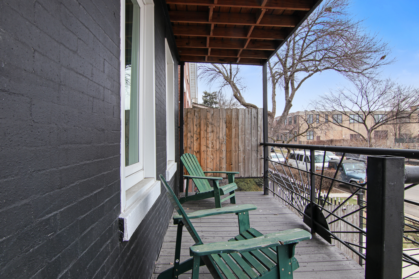 2740 South Troy Street, Unit 1F Chicago, IL 60623 - Photo 2 of 13 a view of balcony with wooden floor and outdoor seating