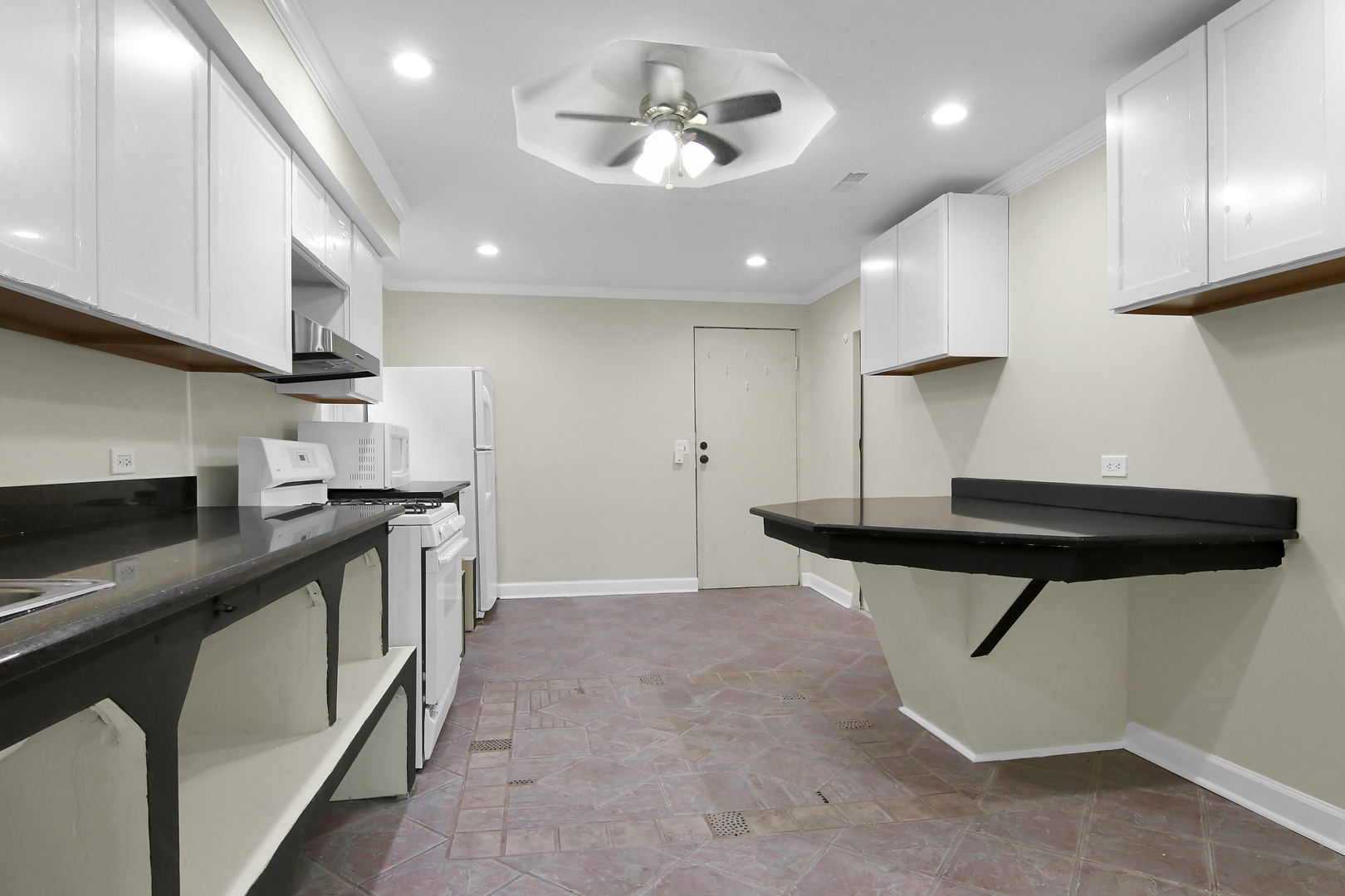 2740 South Troy Street, Unit 1F Chicago, IL 60623 - Photo 8 of 13 a kitchen with stainless steel appliances a refrigerator a sink and a stove