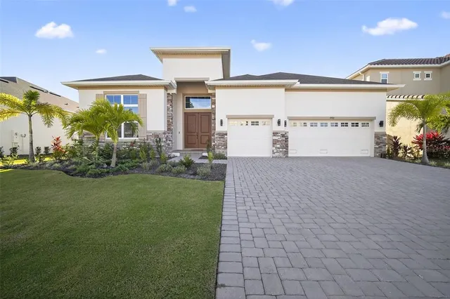 a front view of a building with garden