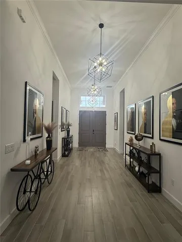 a kitchen with lots of clutter and cabinets