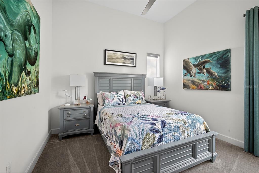 1088 Signet Drive Apollo Beach, FL 33572 - Photo 27 of 49 a bedroom with a bed and a painting on the wall