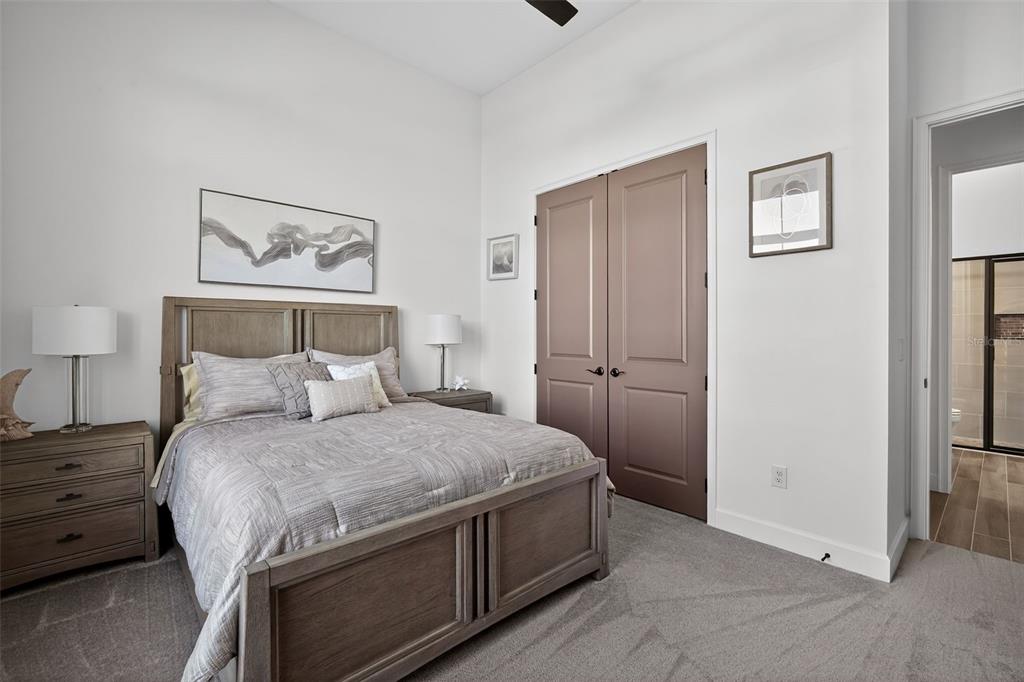 1088 Signet Drive Apollo Beach, FL 33572 - Photo 28 of 49 a bedroom with a bed and a painting on the wall