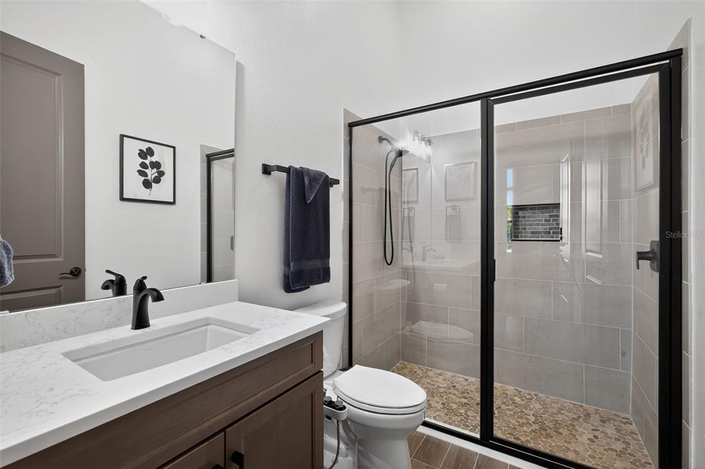1088 Signet Drive Apollo Beach, FL 33572 - Photo 29 of 49 a bathroom with a sink toilet and shower