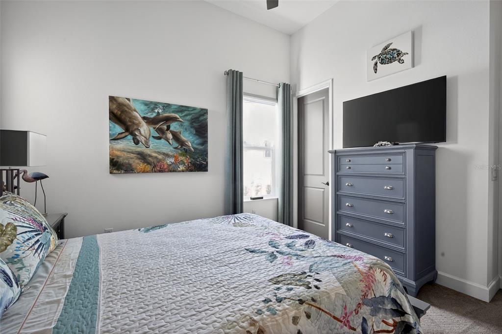 1088 Signet Drive Apollo Beach, FL 33572 - Photo 30 of 49 a bedroom with a bed and a flat screen tv