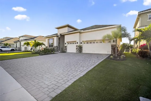 a balcony with furniture and a floor to ceiling window