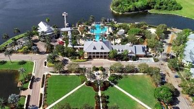 1088 Signet Drive Apollo Beach, FL 33572 - Photo 47 of 49 an aerial view of a house with a garden and lake view