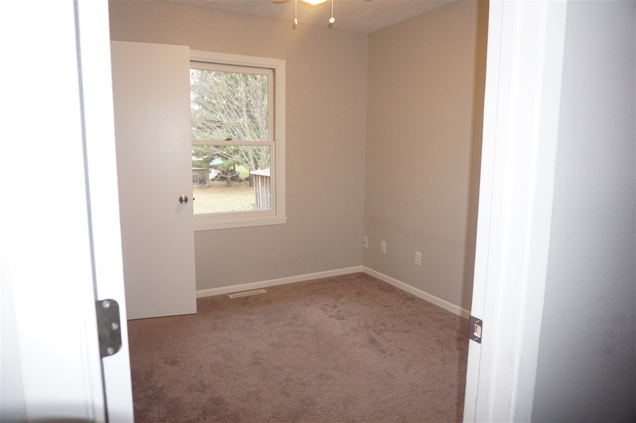 403 Pembroke Road Southwest Poplar Grove, IL 61065 - Photo 12 of 19 a view of an empty room with a window