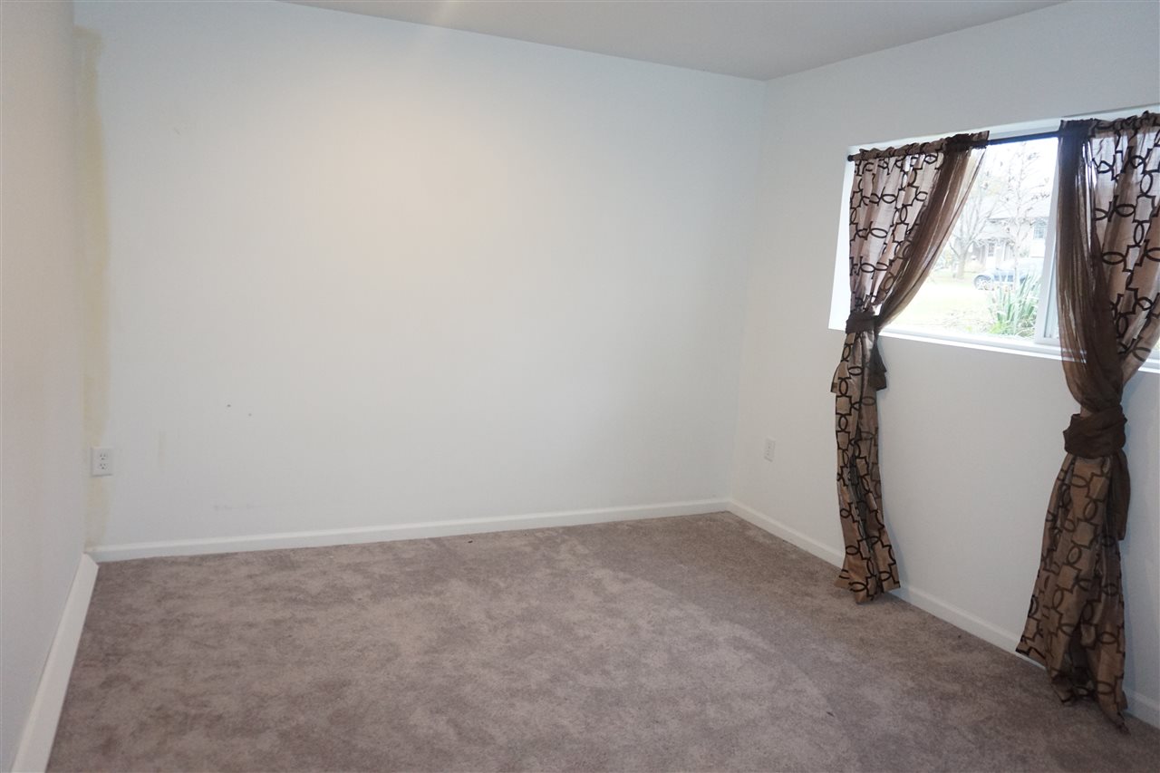 403 Pembroke Road Southwest Poplar Grove, IL 61065 - Photo 15 of 19 a view of an empty room with a window