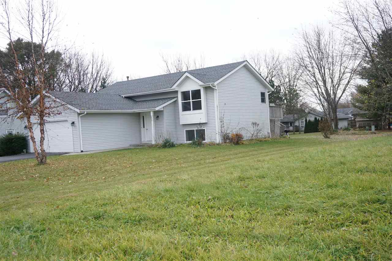 403 Pembroke Road Southwest Poplar Grove, IL 61065 - Photo 2 of 19 a house view with a garden space