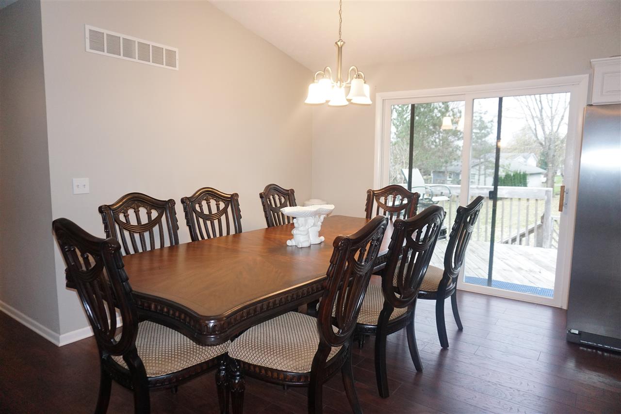 403 Pembroke Road Southwest Poplar Grove, IL 61065 - Photo 6 of 19 a view of a dining room with furniture window and wooden floor
