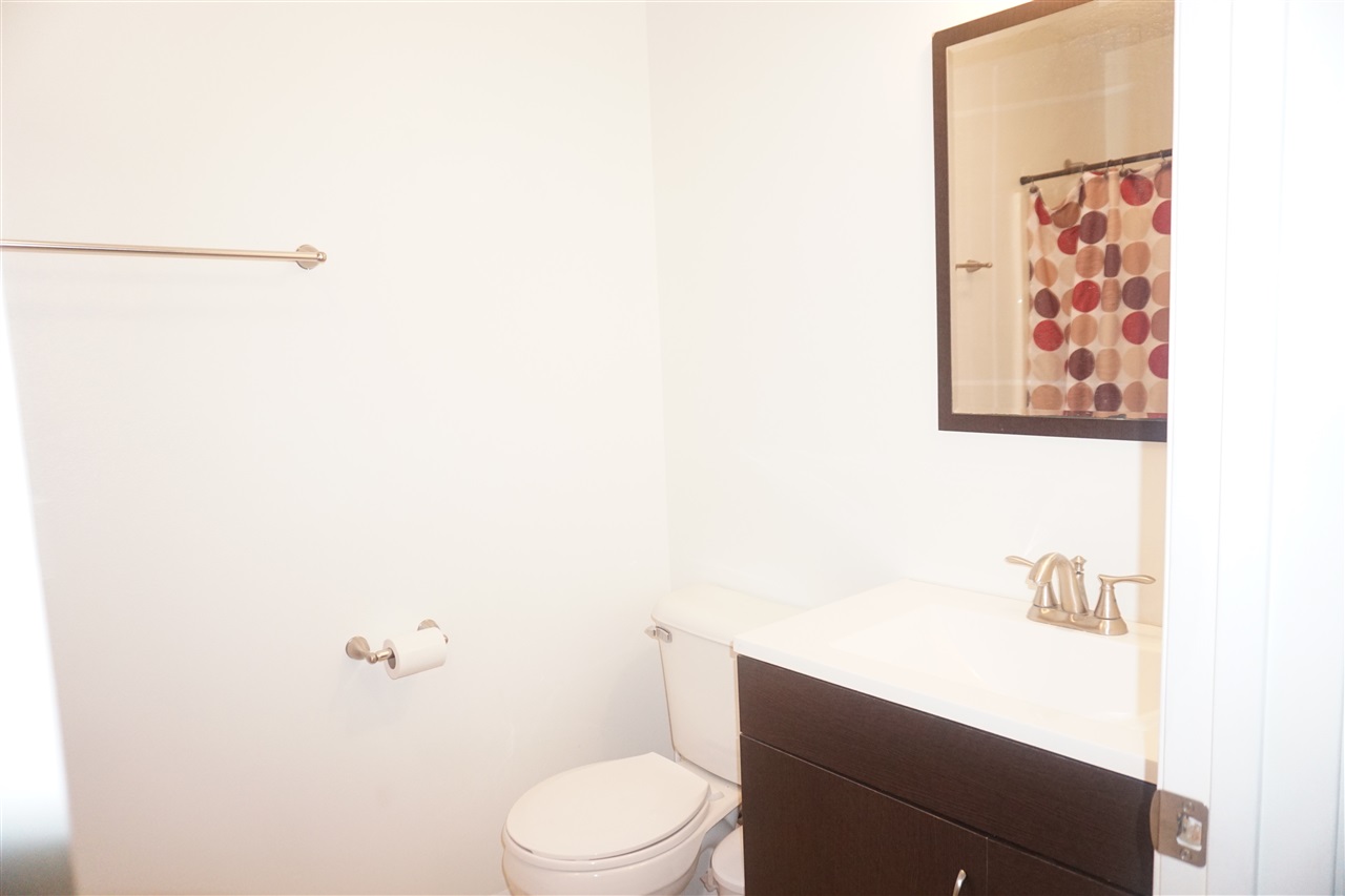 403 Pembroke Road Southwest Poplar Grove, IL 61065 - Photo 9 of 19 a white toilet sitting next to a white sink