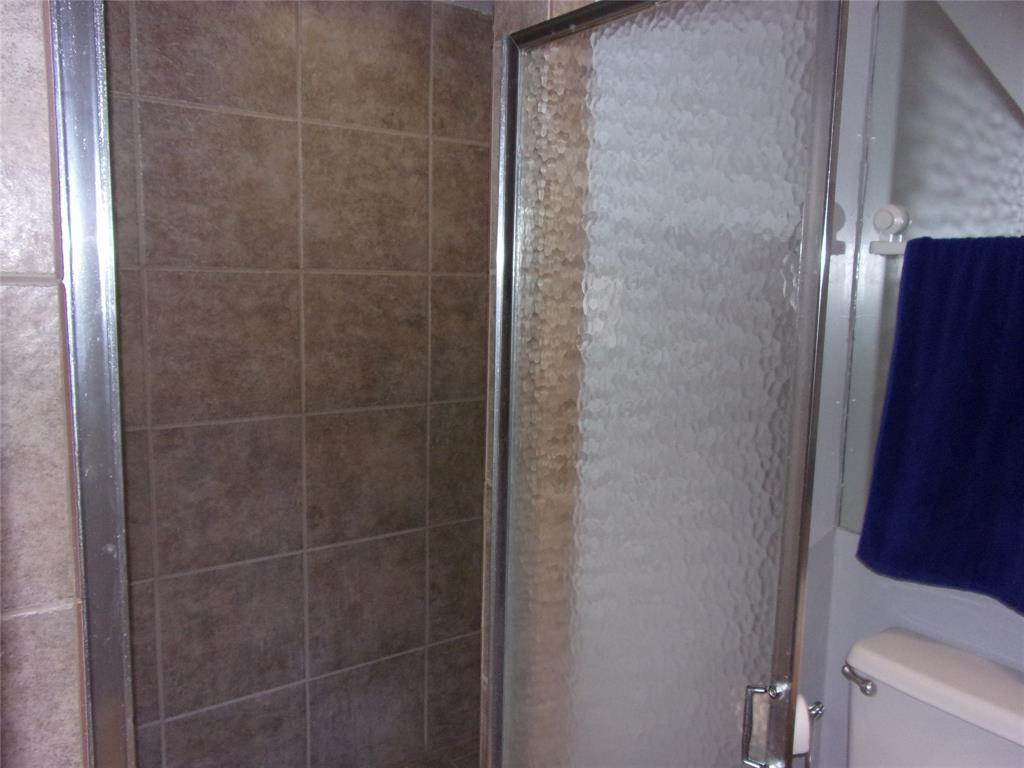 18240 Midway Road, Unit 105 Dallas, TX 75287 - Photo 21 of 37 a bathroom with a shower