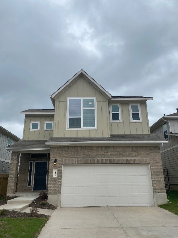 a front view of a house with garage