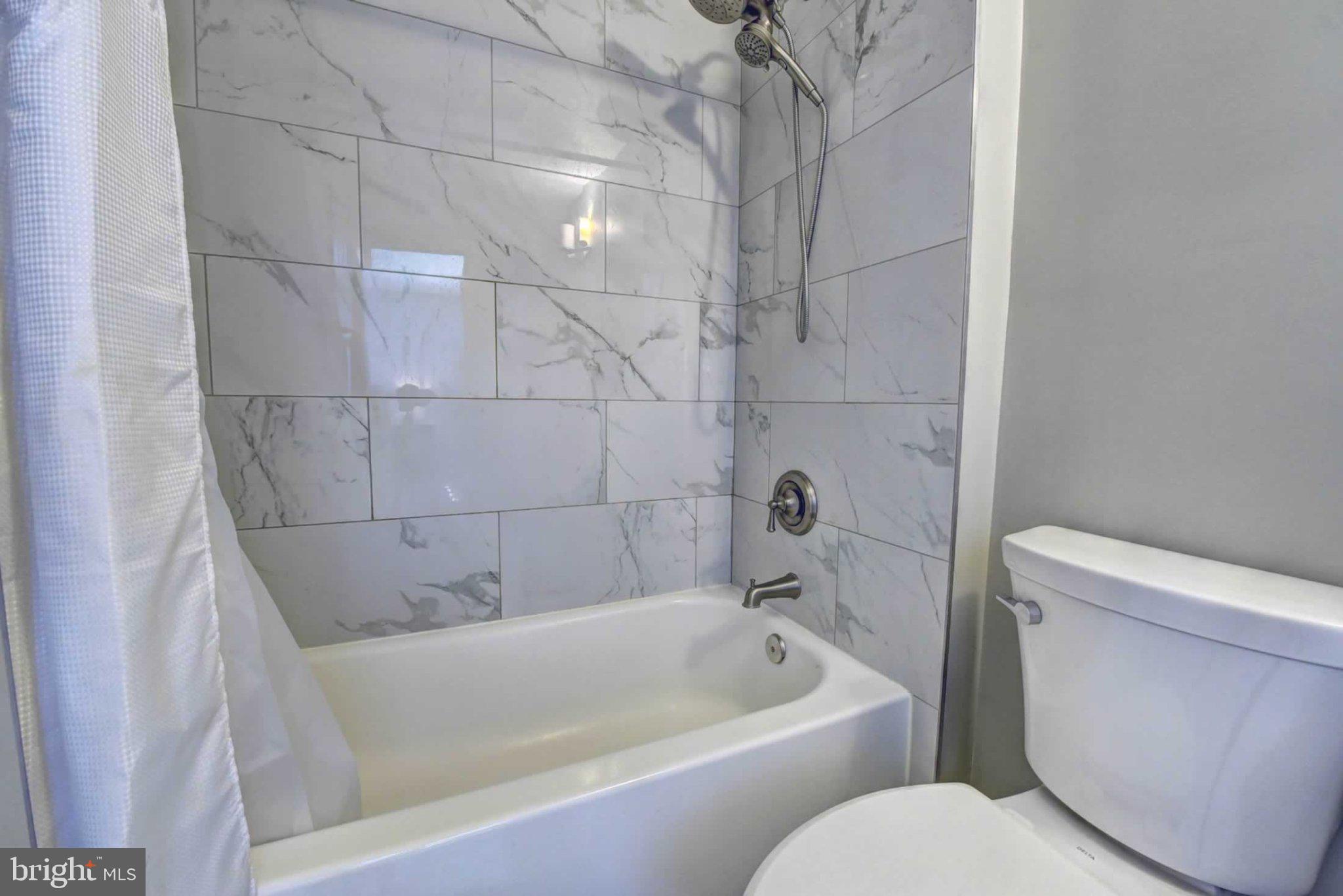 2226 Gunsmith Square Reston, VA 20191 - Photo 23 of 35 a white bath tub sitting next to a white toilet and sink