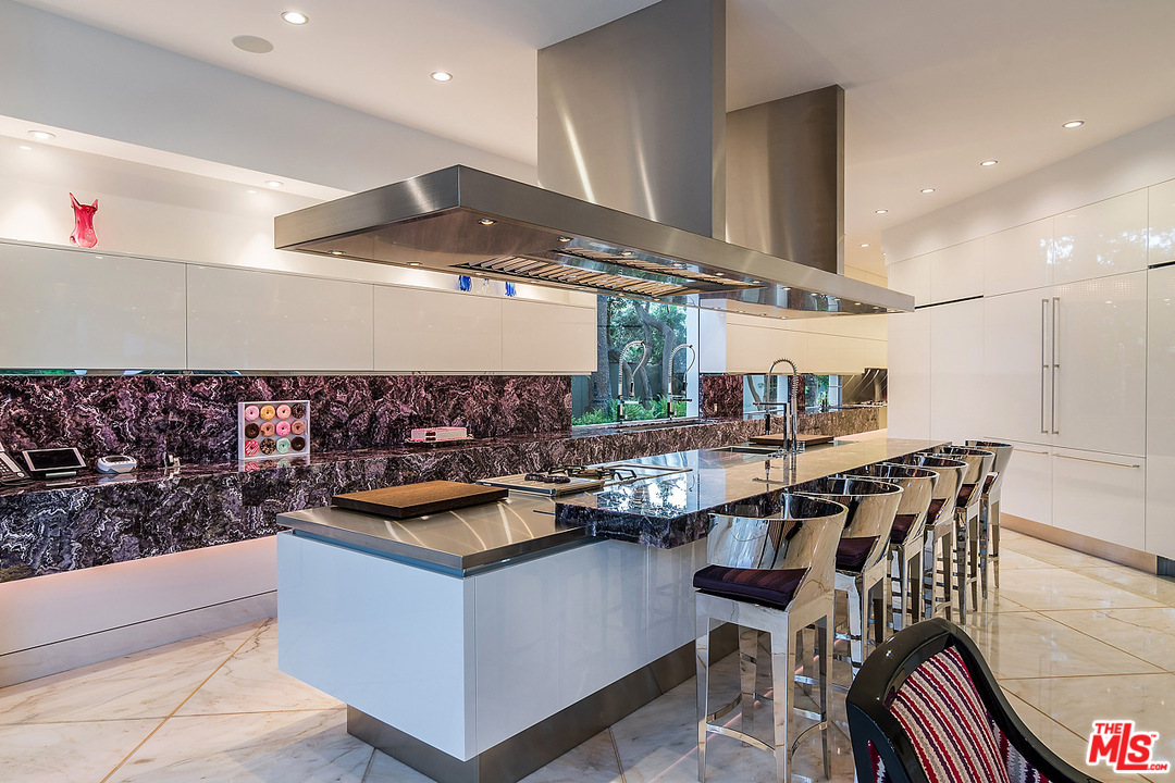1000 Elden Way Beverly Hills, CA 90210 - Photo 16 of 53 a kitchen with a table and chairs in it