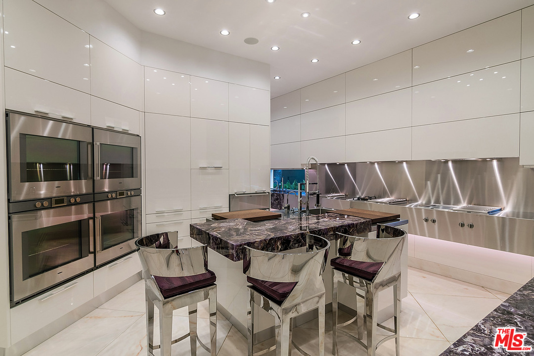 1000 Elden Way Beverly Hills, CA 90210 - Photo 18 of 53 a kitchen with a table and chairs in it