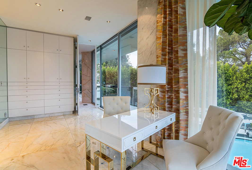 1000 Elden Way Beverly Hills, CA 90210 - Photo 21 of 53 a living room with furniture and a potted plant