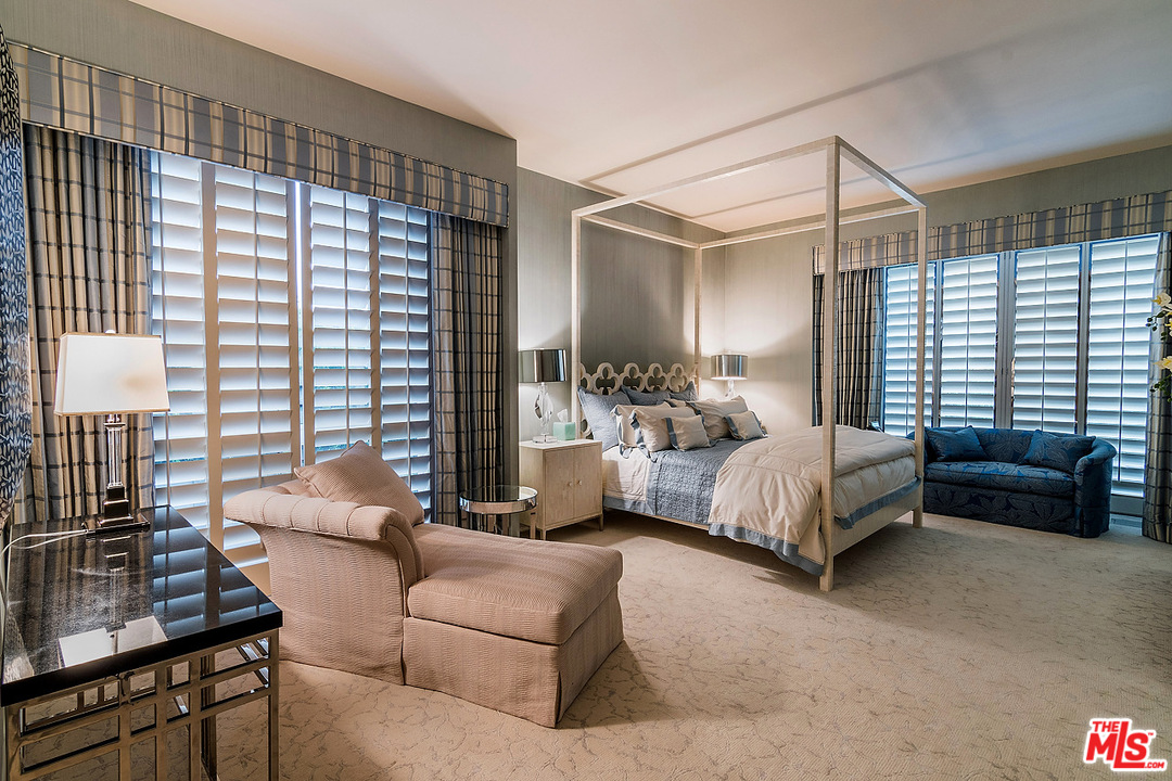 1000 Elden Way Beverly Hills, CA 90210 - Photo 29 of 53 a bedroom with a bed couches and a flat tv screen