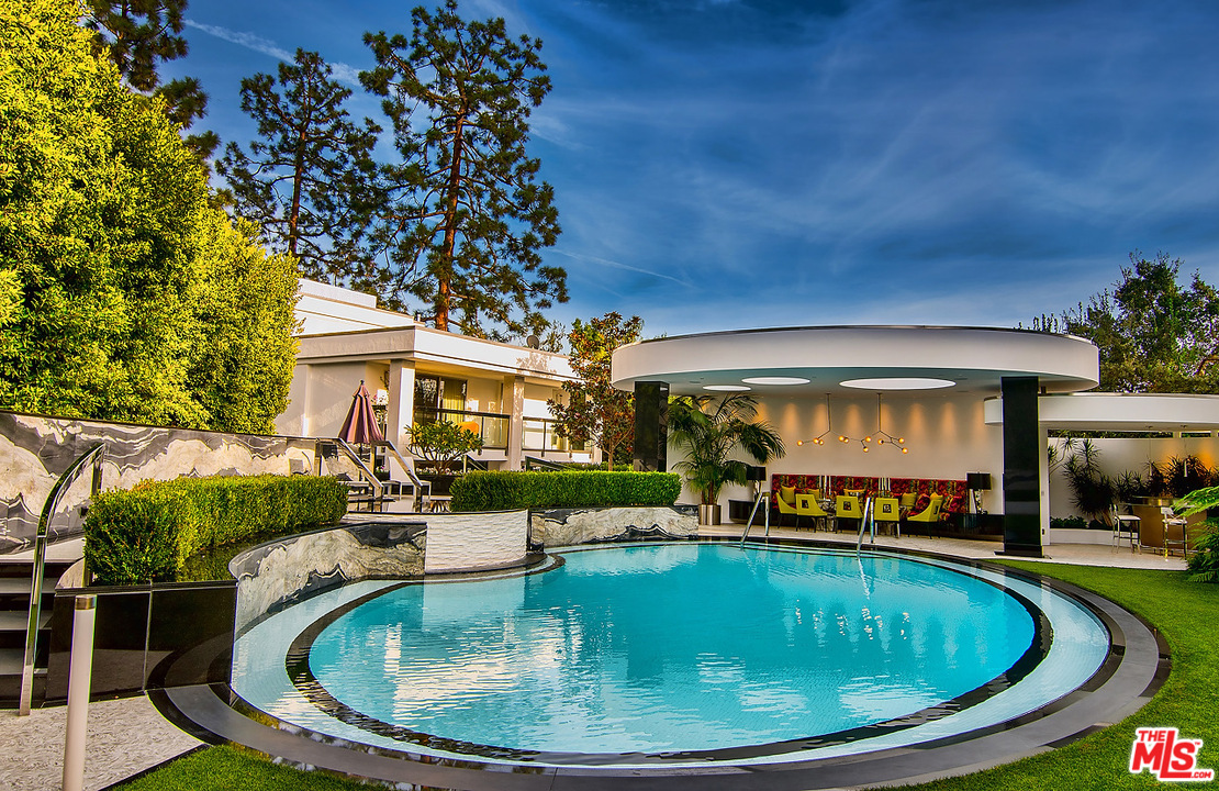 1000 Elden Way Beverly Hills, CA 90210 - Photo 32 of 53 a view of a swimming pool with a patio