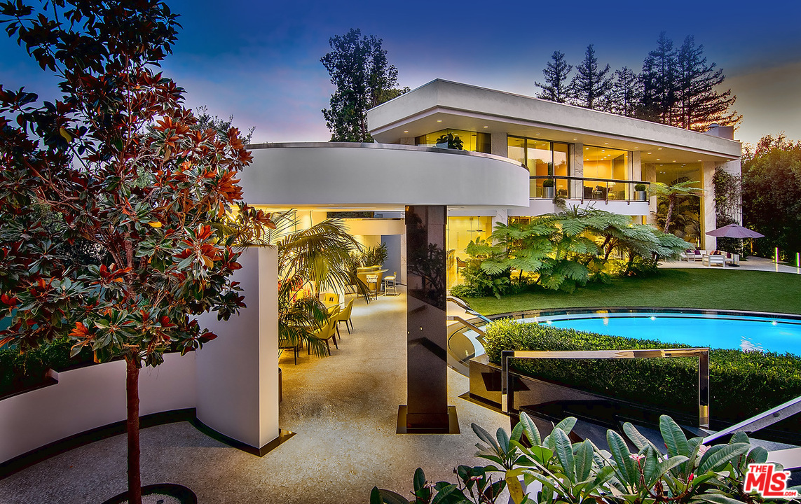 1000 Elden Way Beverly Hills, CA 90210 - Photo 34 of 53 a view of a swimming pool with a patio