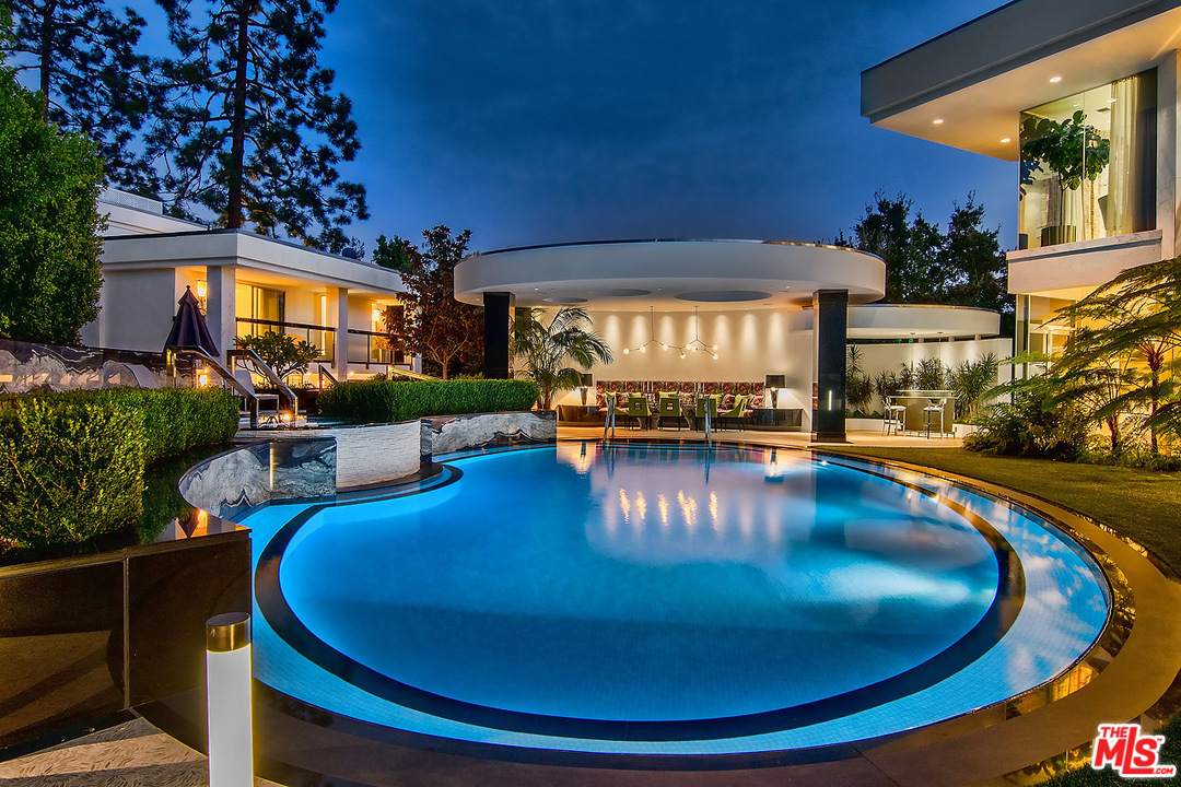 1000 Elden Way Beverly Hills, CA 90210 - Photo 38 of 53 a view of a swimming pool with an outdoor seating