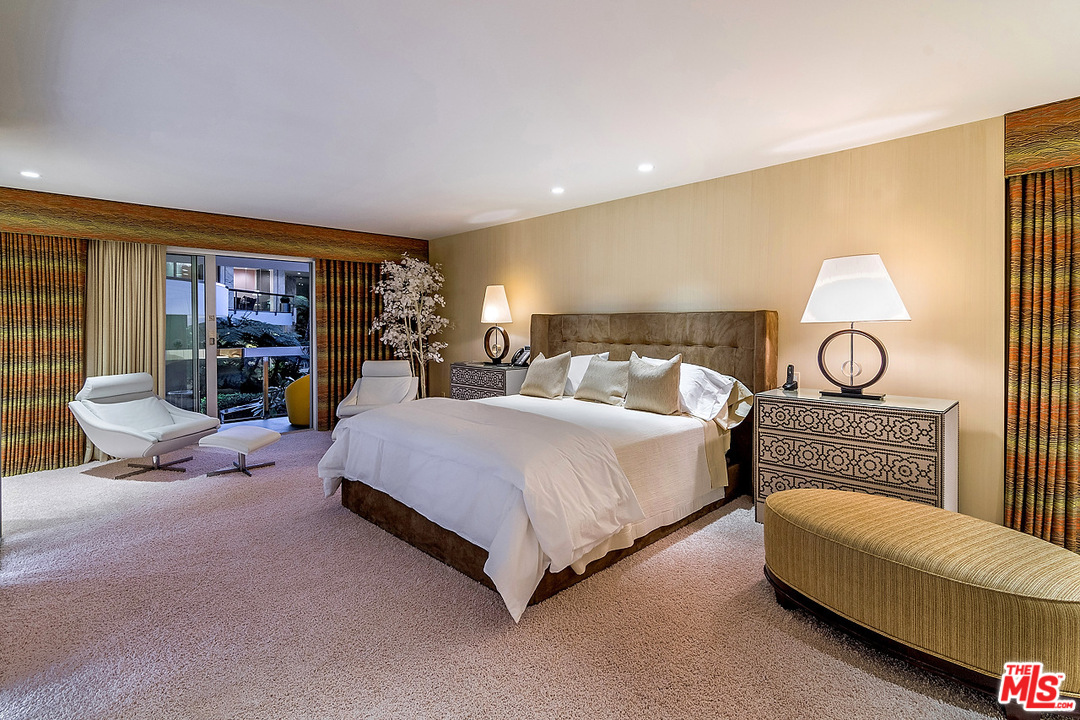 1000 Elden Way Beverly Hills, CA 90210 - Photo 43 of 53 a spacious bedroom with a bed and walk in closet