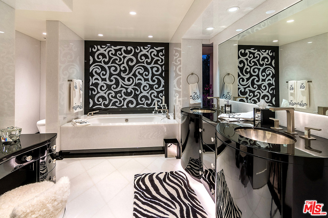 1000 Elden Way Beverly Hills, CA 90210 - Photo 45 of 53 a bathroom with a bathtub and a shower