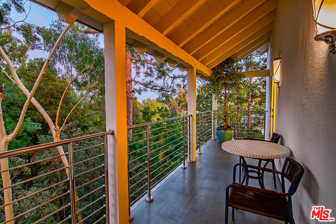 1000 Elden Way Beverly Hills, CA 90210 - Photo 50 of 53 a view of a chair and table in the balcony