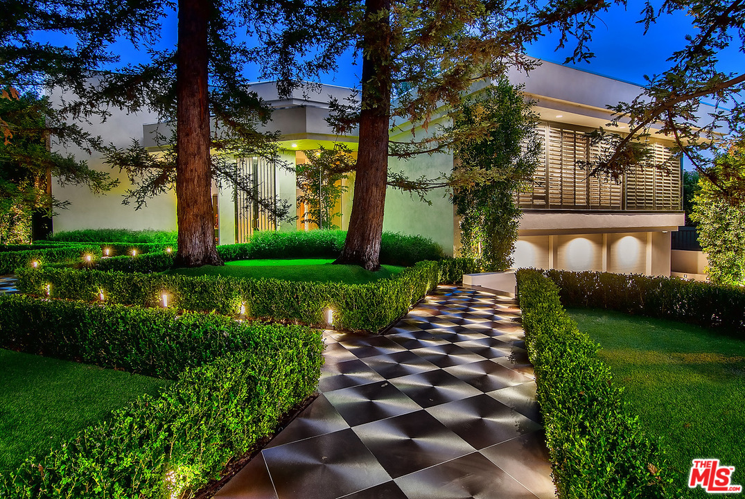 1000 Elden Way Beverly Hills, CA 90210 - Photo 6 of 53 a front view of a house with garden