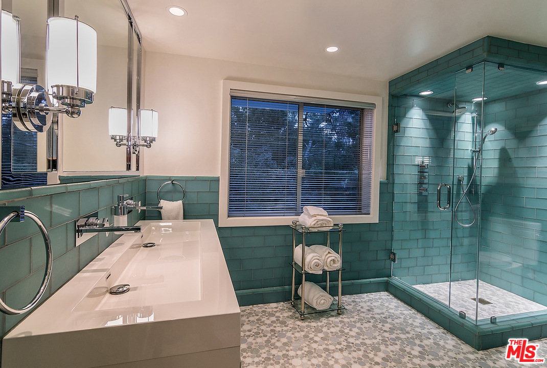 1000 Elden Way Beverly Hills, CA 90210 - Photo 51 of 53 a bathroom with a bathtub and sink