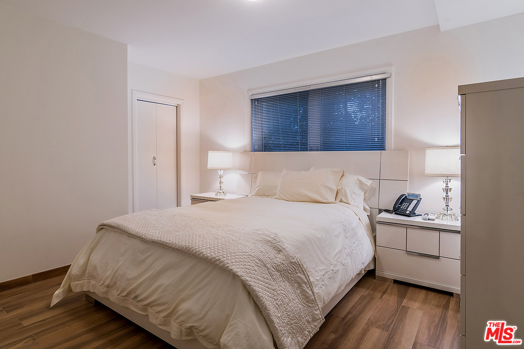 1000 Elden Way Beverly Hills, CA 90210 - Photo 53 of 53 a bedroom with a bed and wooden floor