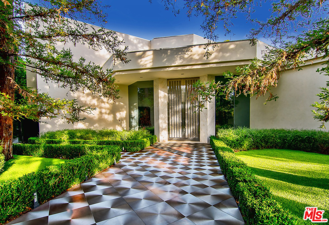1000 Elden Way Beverly Hills, CA 90210 - Photo 7 of 53 a view of a pathway with a building in the background