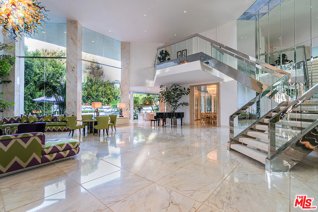 1000 Elden Way Beverly Hills, CA 90210 - Photo 10 of 53 a view of a livingroom with furniture and lots of potted plants