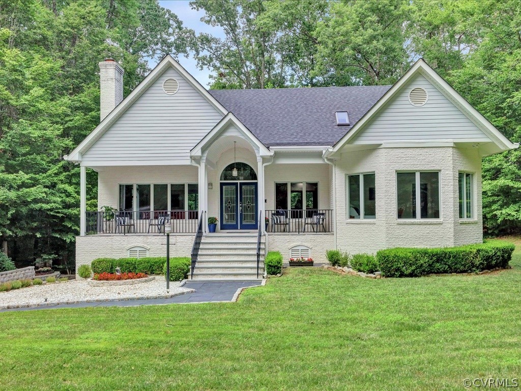 Front Elevation - home features white brick and Ha