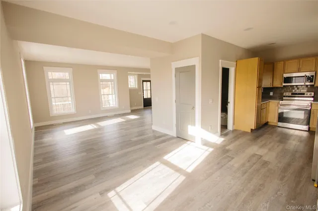 a view of house with backyard