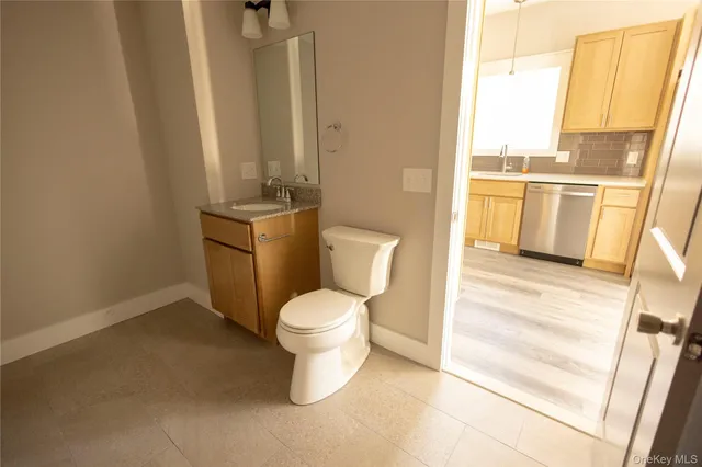 a bathroom with a toilet and a sink