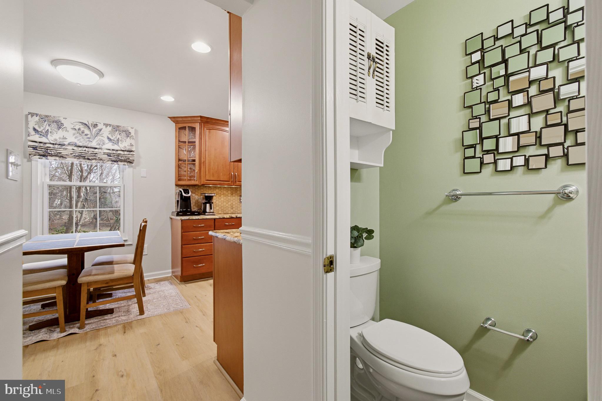 4705 Ilkley Moor Lane Ellicott City, MD 21043 - Photo 19 of 69 a bathroom with a toilet a sink and a shower