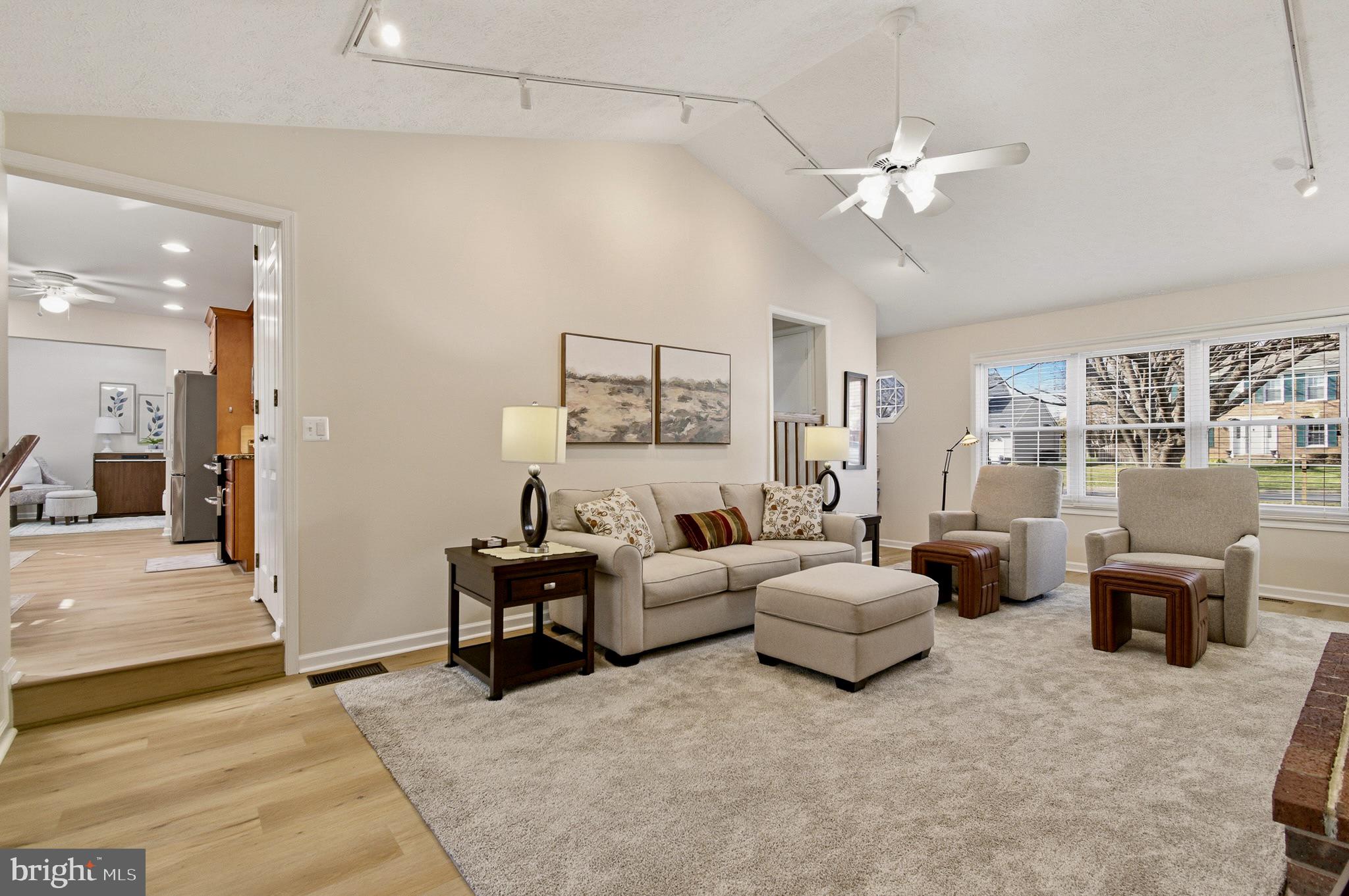 4705 Ilkley Moor Lane Ellicott City, MD 21043 - Photo 20 of 69 a living room with furniture and a chandelier