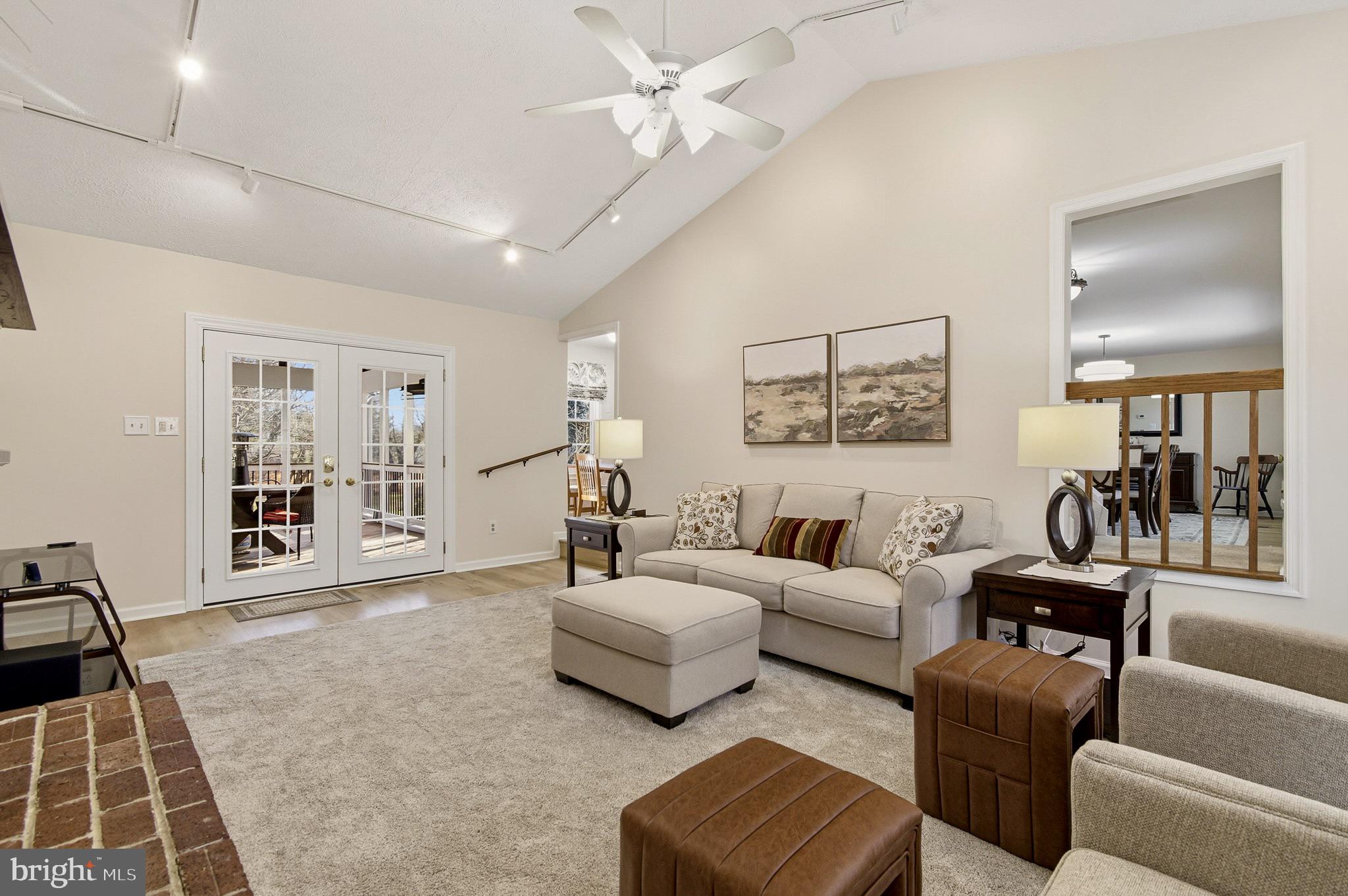 4705 Ilkley Moor Lane Ellicott City, MD 21043 - Photo 22 of 69 a living room with furniture and a rug