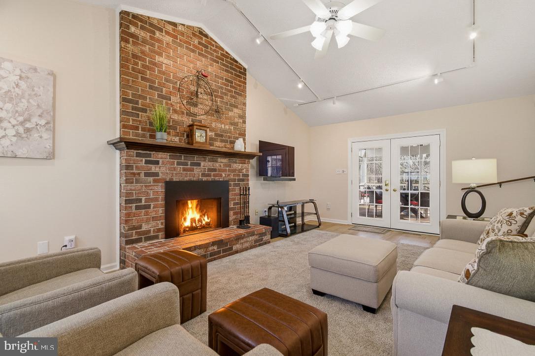 4705 Ilkley Moor Lane Ellicott City, MD 21043 - Photo 24 of 69 a living room with furniture and a fireplace